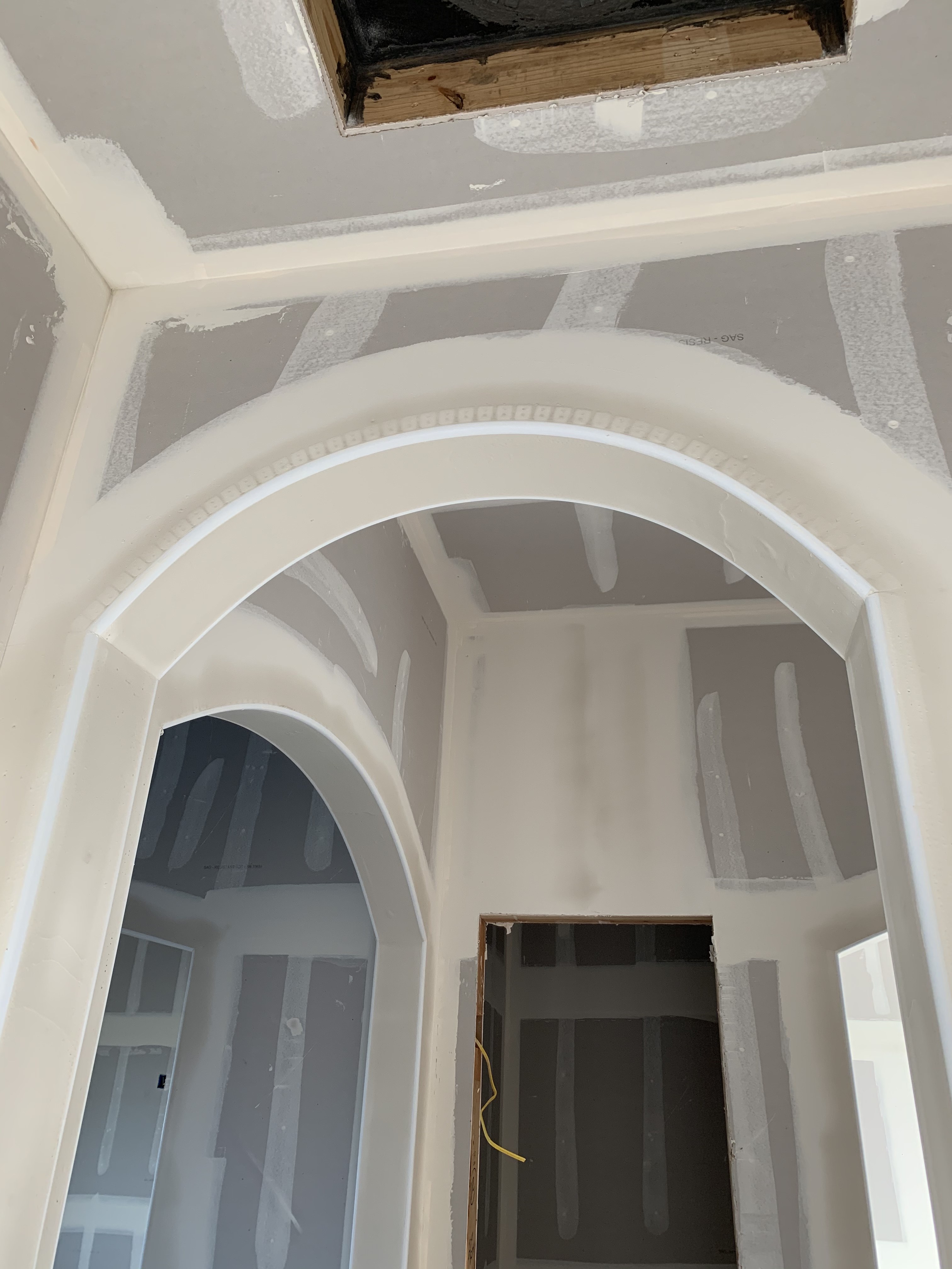 Old Gin new build — arched opening at drywall stage