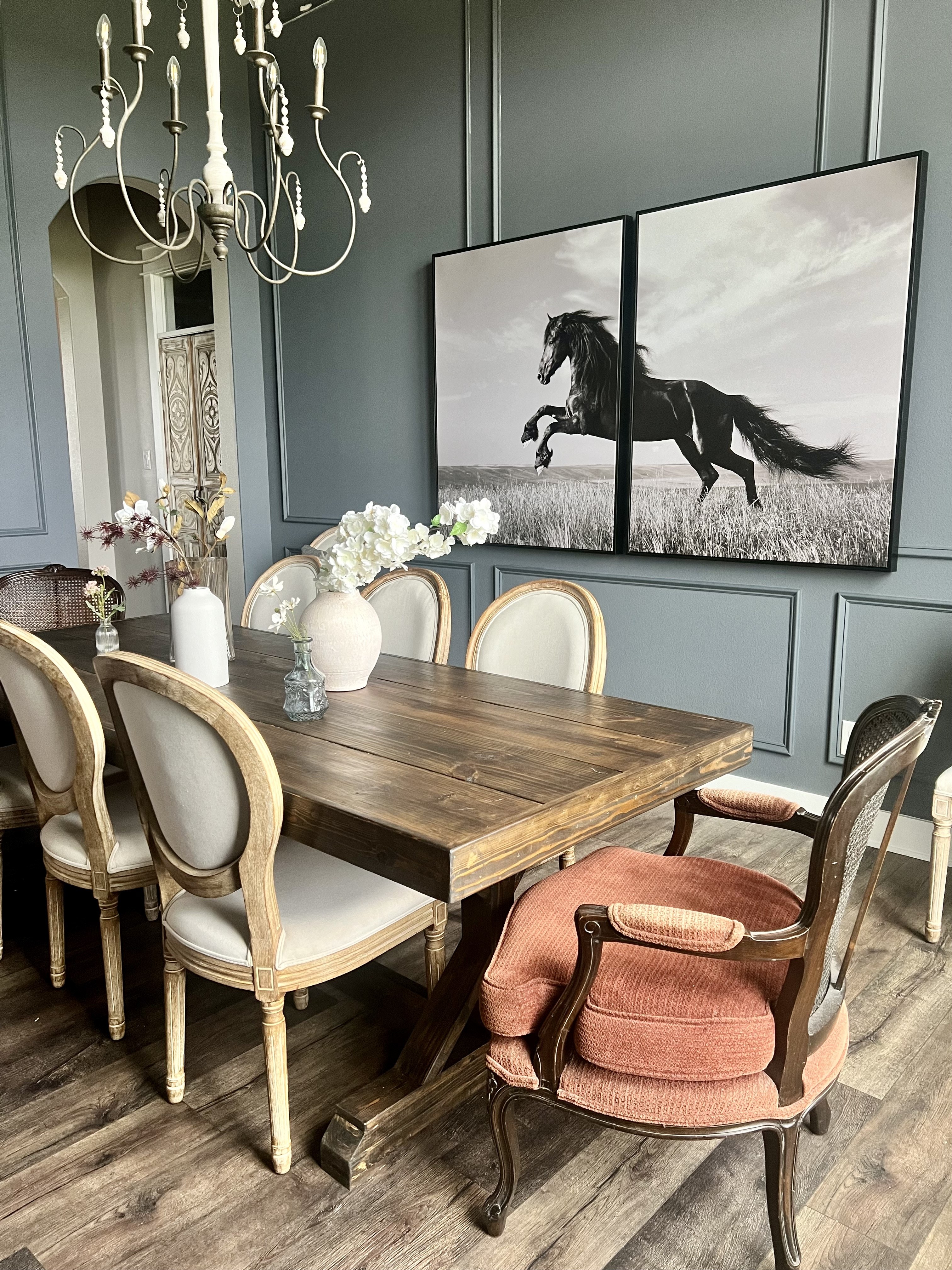 Old Gin dining room — horse artwork diptych, vintage chandelier and mixed dining chairs