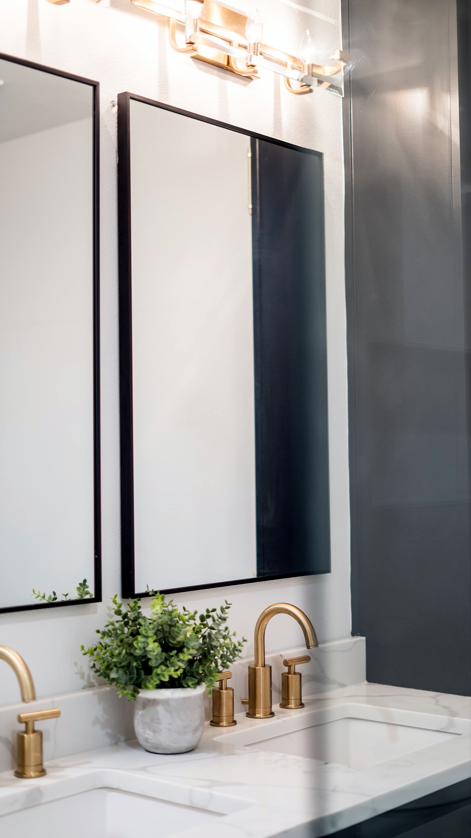 Summer Glen renovation — finished bathroom vanity with gold fixtures