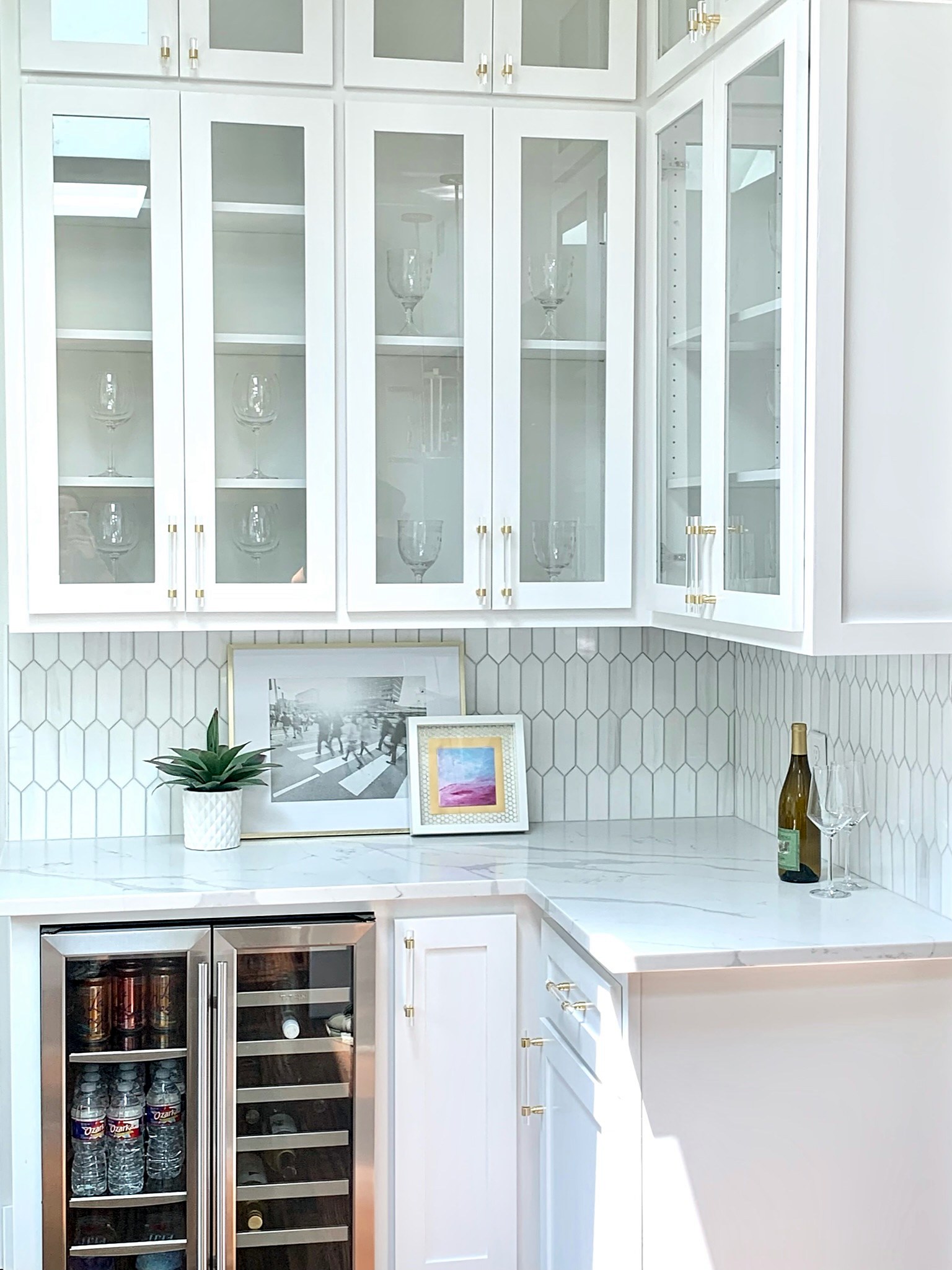 Summer Glen renovation — wet bar with glass cabinets and marble countertops
