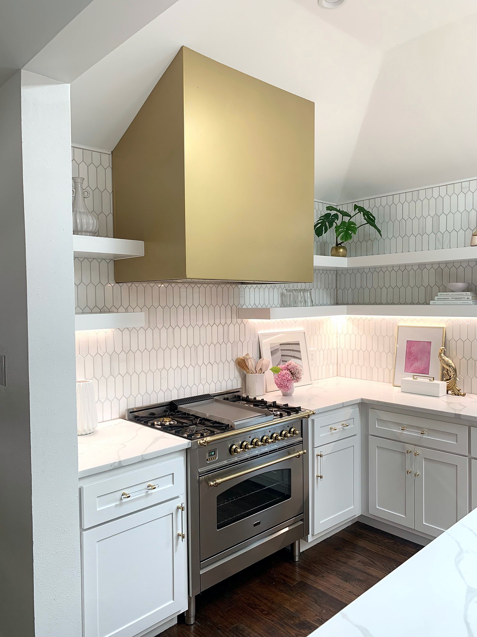 Summer Glen renovation — kitchen with gold range hood and open shelving