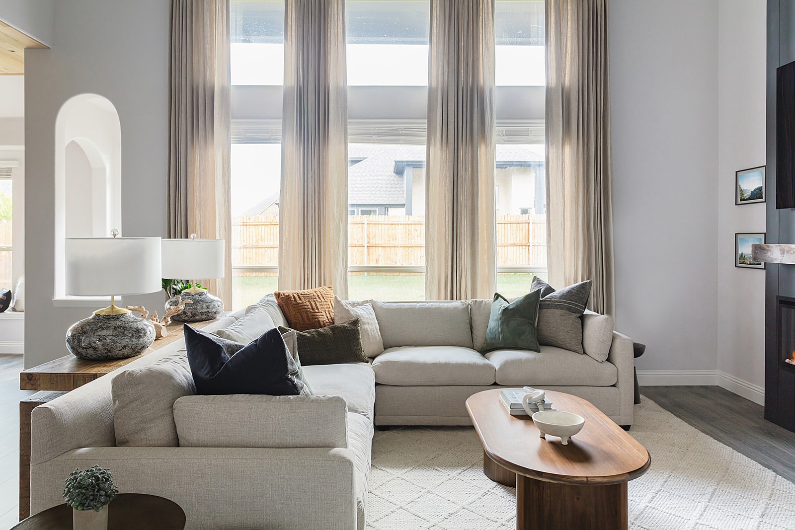 Strait Lane living room — black fireplace, custom sofa and modern rustic styling