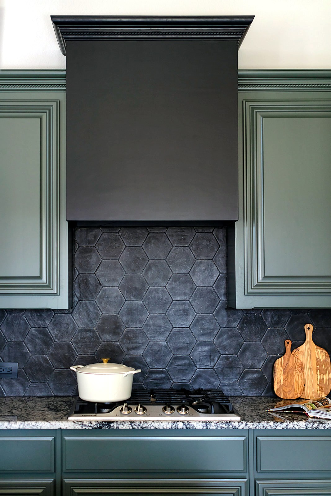 Strait Lane kitchen remodel — cabinetry, tile and countertop composition
