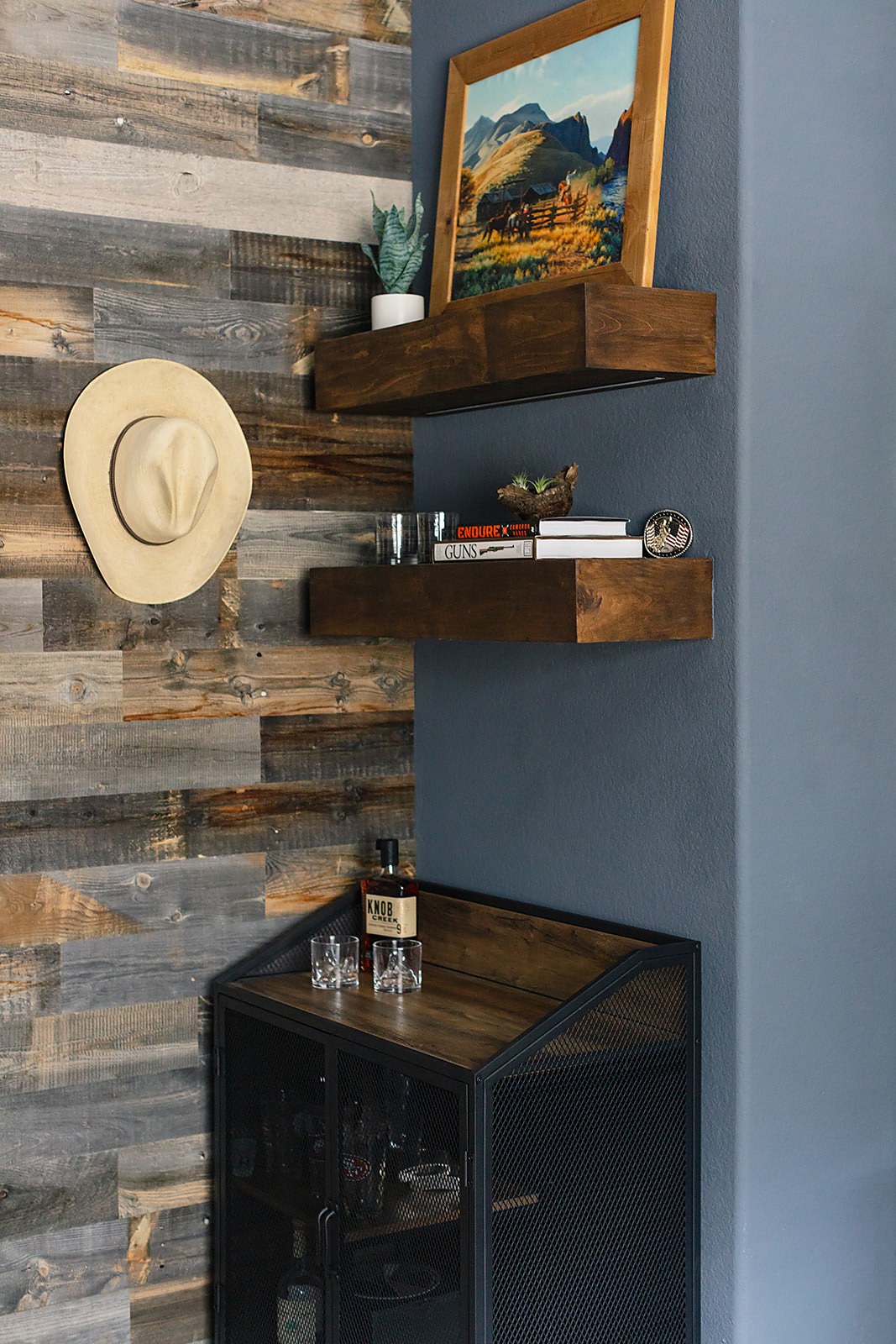 Strait Lane man room — rustic accent wall with custom storage