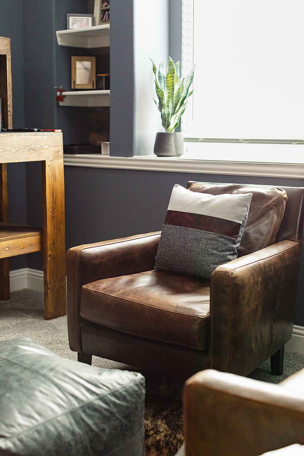 Strait Lane man room — concealed storage and whiskey bar area