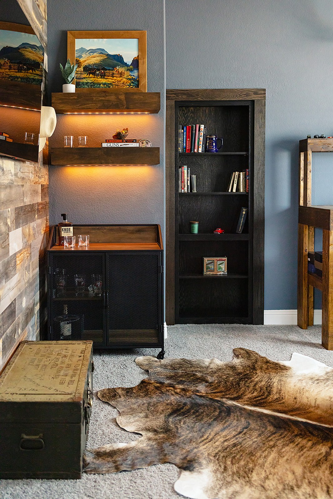 Strait Lane man room — feature wall and built-in bar detail
