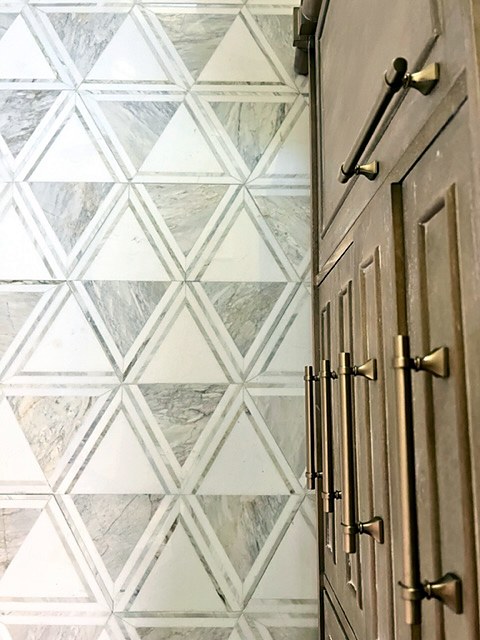 Shady Oaks — feminine bathroom geometric triangle tile and brass cabinet pulls detail