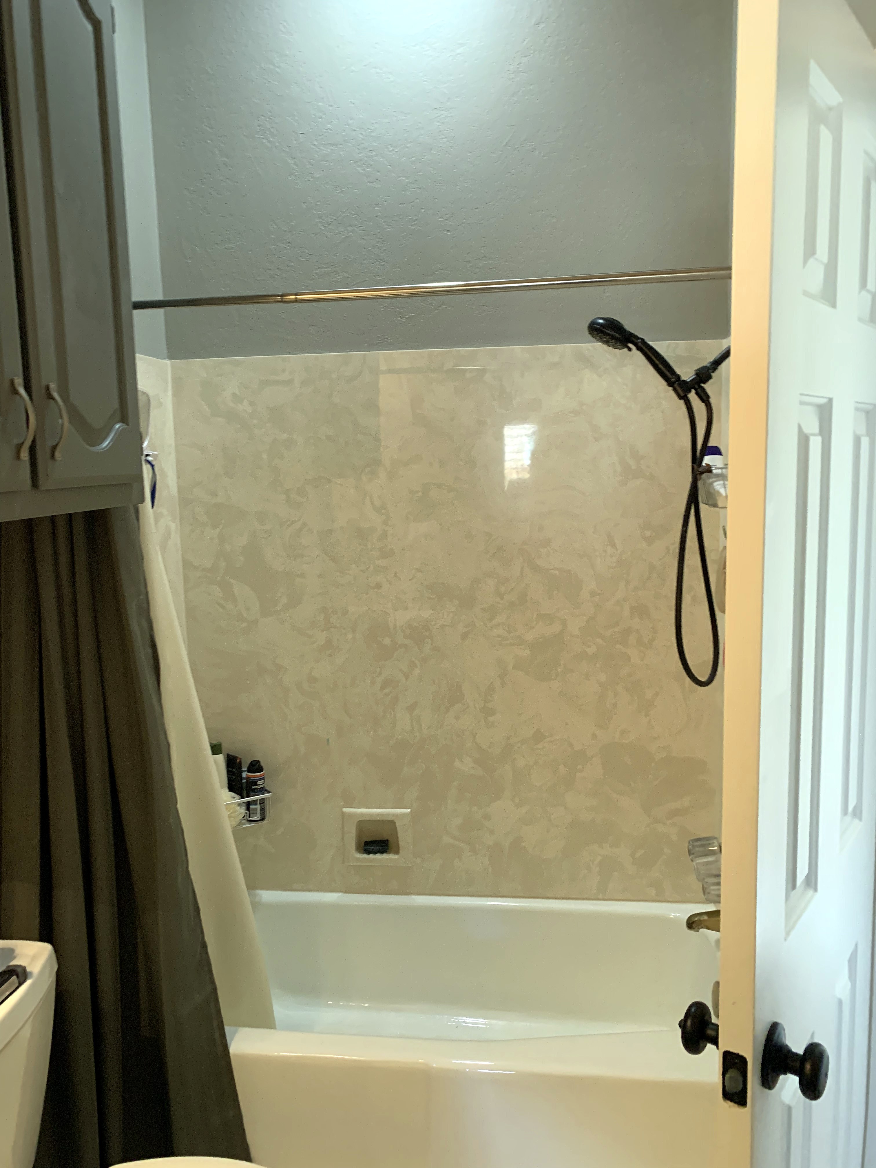 Shady Oaks — masculine bathroom before renovation, original tub and shower with curtain